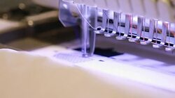 sewing machine or embroidery machine is used to create patterns on textiles Stock Footage
