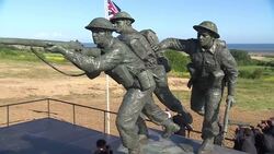 Theresa May and Emmanuel Macron at new British D-Day memorial News Clip