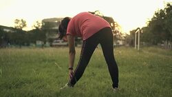 back side woman standing healthy lifestyle  in green grass field sun light Stock Footage