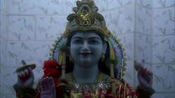 MEDIUM ANGLE OF FACE OF STATUE OF HINDU GOD. RELIGIOUS. Stock Footage