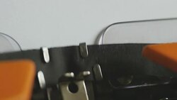 High and side angle footage of a person writing ISLAMOPHOBIA on an old typewriter, with sound Stock Footage