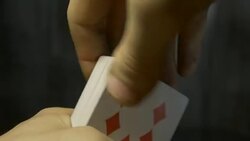 hands holding shuffle playing card deck on wooden table Stock Footage
