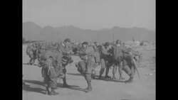 Three thousand paratroopers prep for practice drop behind fighting lines during Korean War News Clip