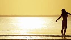 Ethnic female in swimwear on tropical ocean beach Stock Footage