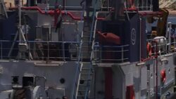 Artwork on bank of Suez Canal and ships moving to port News Clip