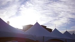 Canvas tents at a fundraising event at a early morning downtown area Stock Footage