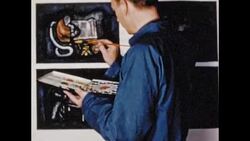 Artist adds color to sketch, 1950s Stock Footage