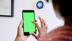 View Through Doorway Of High School Tutor Sitting On Desk Teaching Class Stock Footage
