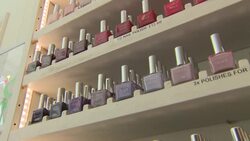 Nail polish on shelves of a beauty salon News Clip
