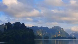 view of landscape limestone mountain rang and green forest with water lake Stock Footage