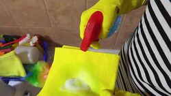 Housewife sprays large amount of cleaning fluid Stock Footage