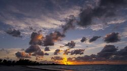 Sunset cloudscape on luxury ocean beach island vacation Stock Footage