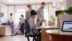 Creative designers working in open plan office Stock Footage