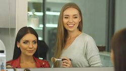 Beautiful girl does a hairstyle in a beauty salon Stock Footage