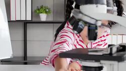 Education Topics:Funny little girl doing experiments in the laboratory.Science and education. Stock Footage