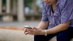 Asian Senior Woman in Public Park Stock Footage