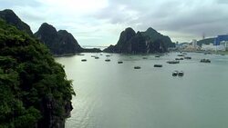 4k Aerial Over boats docked in bay with karst mountains. Ha long bay. Halong City. Stock Footage