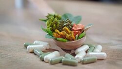 Herbal therapy concept. Medical herbs and pills. Herbal medicine capsules Stock Footage