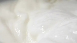Milk splash in slow motion Stock Footage