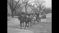 Officials riding in old coach rolling down street in Williamsburg, VA News Clip