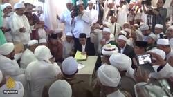 Indonesian Muslim leader turns himself in over COVID rule breach News Clip