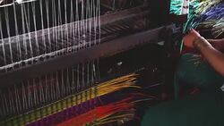 4k footage scene of Vietnamese craftswoman using Mat weaving machine the traditional Vietnam mats in the old traditional village at Dinh Yen, Dong Thap, Vietnam, Tradition and manufacture concept Stock Footage