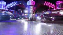 Colorful spinning wheel in amusement park at night Stock Footage