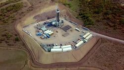 Aerial View of a Fracking Drilling Rig in the Autumn Mountains of Colorado Stock Footage