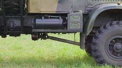 View under the military truck in the grass lawn in Valga Estonia Stock Footage