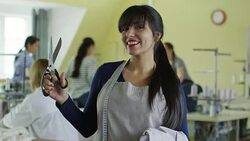 Portrait of Young Seamstress Holding Scissors Stock Footage
