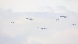 C-130 Hercules and V-22 Osprey aircrafts flying overhead as part of D-Day 75th Anniversary commemorative event News Clip