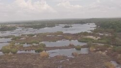 Drone aerials over the Victoria Falls and Zambezi River News Clip