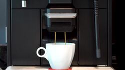 Making coffee latte or cappuccino at automatic machine Stock Footage