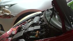 Mechanic checking oil level Stock Footage