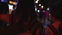Slow motion - Traveler backpacker Asian women lesbian lgbt couple travel in Bangkok, Thailand. Female drinking alcohol or beer at The Khaosan Road the most famous street in Bangkok. Stock Footage