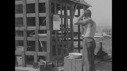 Men building a shack near a group of high-rises News Clip