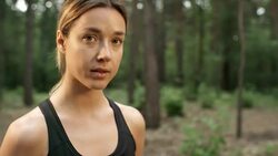 Woman Smiling for Camera in Forest Stock Footage