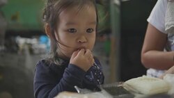Happy Asian baby girl eating food at home. feed by her mom. Concept : Food,Family,life. Stock Footage