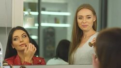 Beautiful girl does a hairstyle in a beauty salon Stock Footage