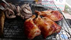 Assorted delicious grilled meat over the coals on a barbecue, top view Stock Footage