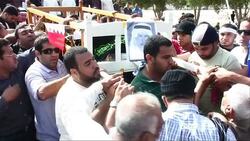 Tens of thousands gather for funerals of anti government protesters. News Clip