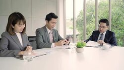 Slow motion - Businessman meeting in workplace with his colleague and signing a contract, recruitment and agreement concept. Male making a deal. Stock Footage