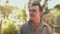 Middle aged farmer on farmland Stock Footage