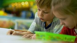 Faces of Little Kids Drawing Picture Stock Footage