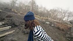 Young female tourist admiring Mt.Fuji's mossy landscape Stock Footage