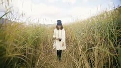 Asian tourist woman taking pictures of the mountainside with her camera at Stock Footage