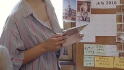 Creative designers discussing photographs in office meeting Stock Footage