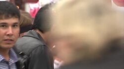 People browsing souvenir stalls in Manezh Square, Moscow News Clip