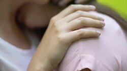 Cute lesbian hugging her girlfriend and kissing tenderly in shoulder, lgbt, love Stock Footage