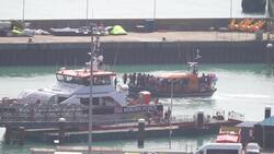 Group of people thought to be migrants arrive in Dover News Clip
